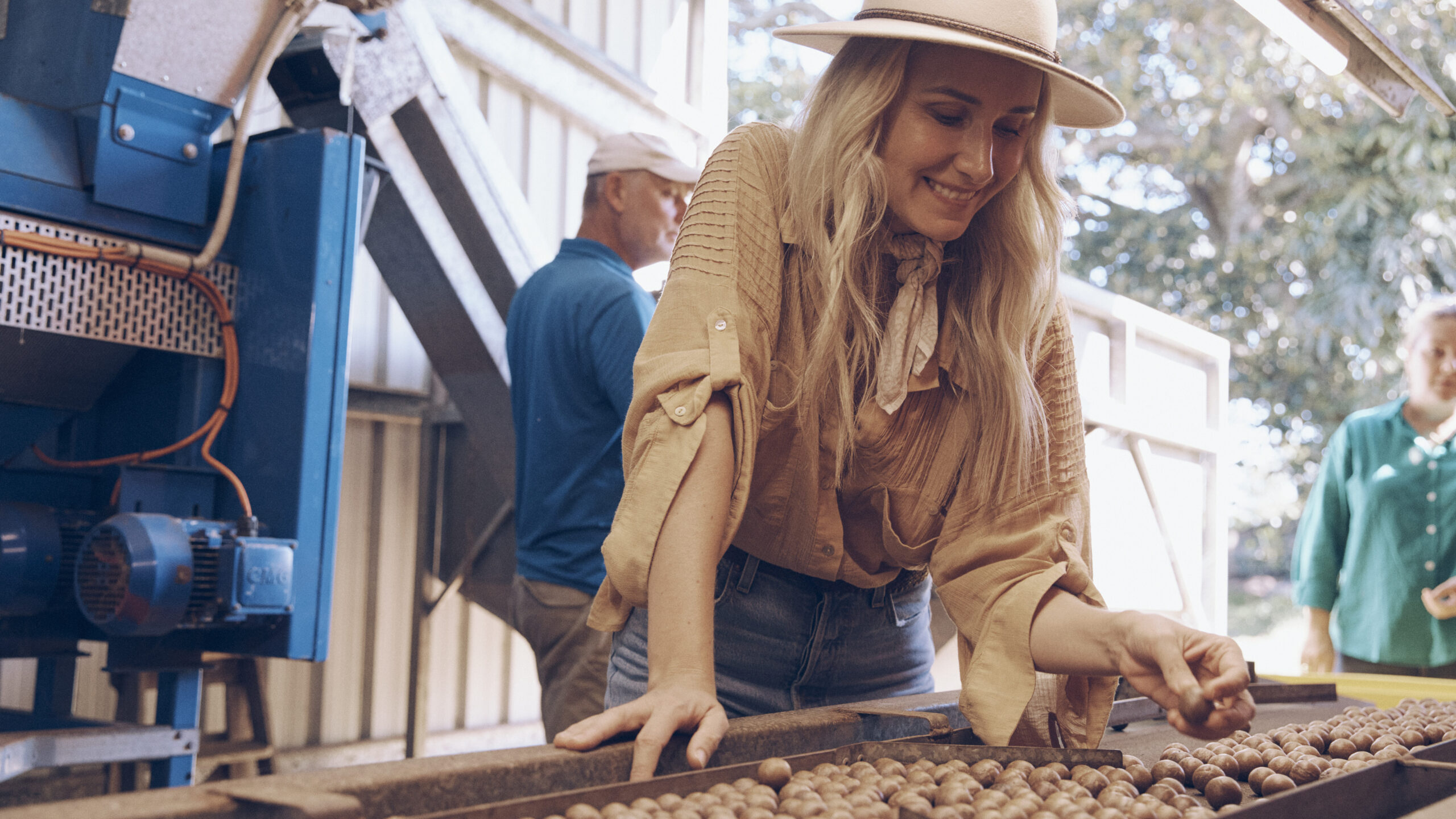 Magdalena Roze sorting macadamias during harvest
