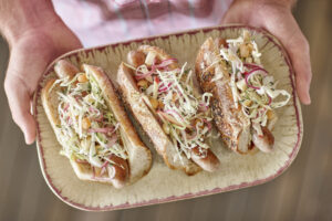 Apple and macadamia coleslaw with sausages