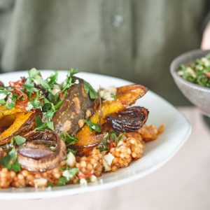 Pearl couscous with caramelised pumpkin, onions and macadamia chimichurri