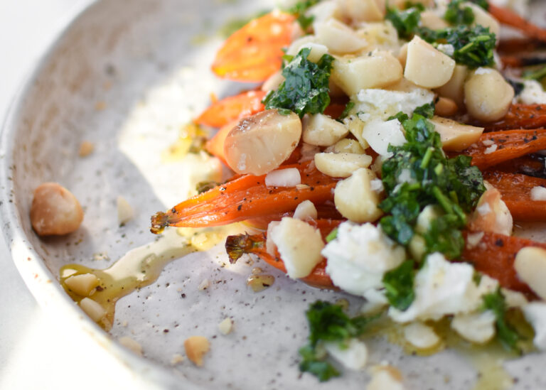 Roasted baby carrots with macadamia nut topping
