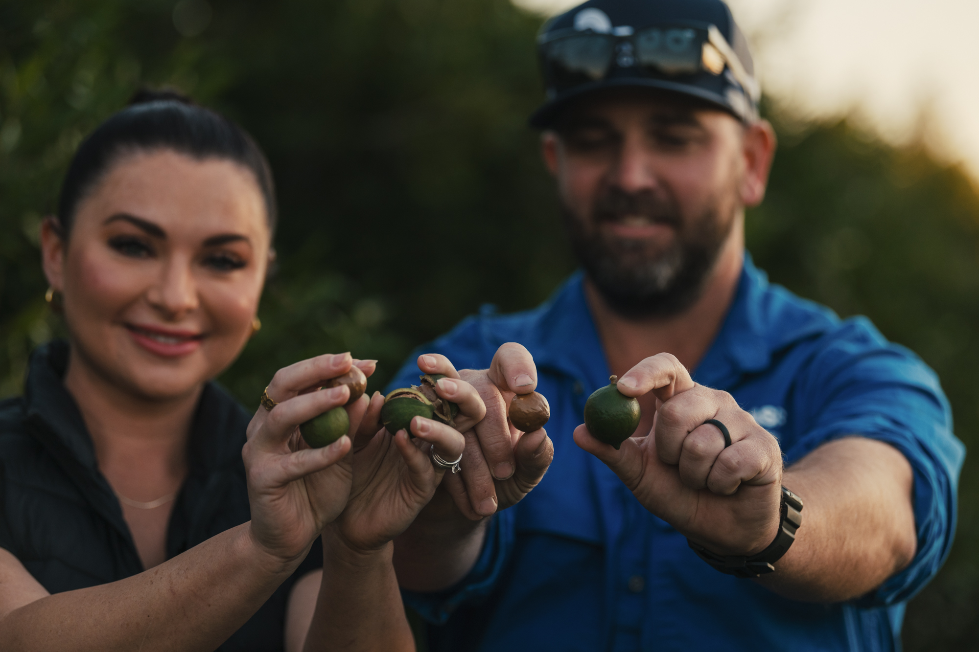 Photo of Rhys & Sara Abdy with Australian macadamia nuts they have grown
