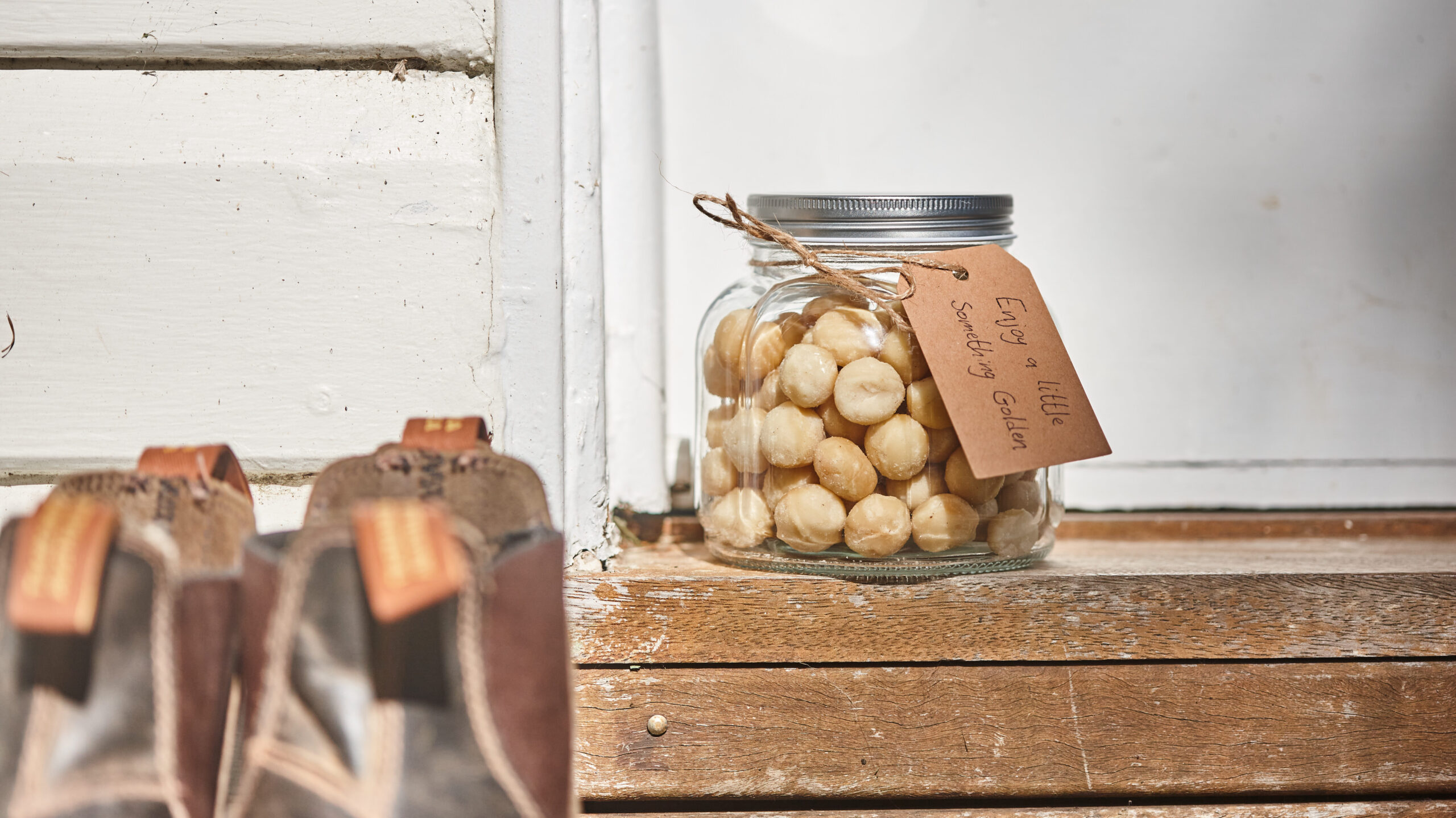 Jar of macadamia nuts on the doorstep