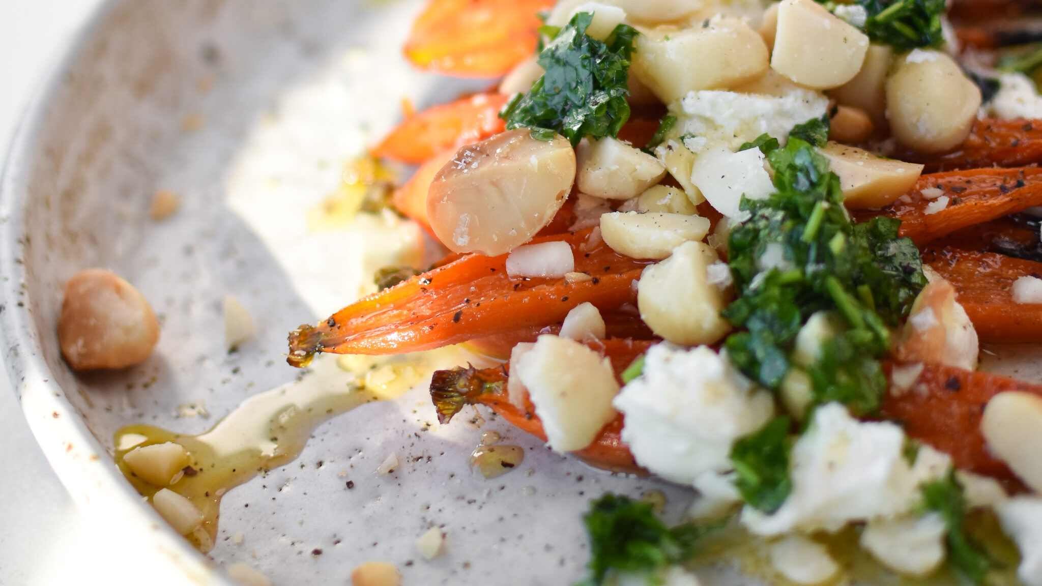 Roasted baby carrots with macadamia nut topping