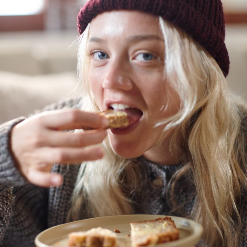 2605 Macadamia banana bread girl eating 2