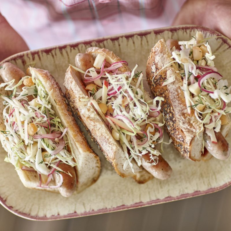 Apple and macadamia coleslaw with sausages