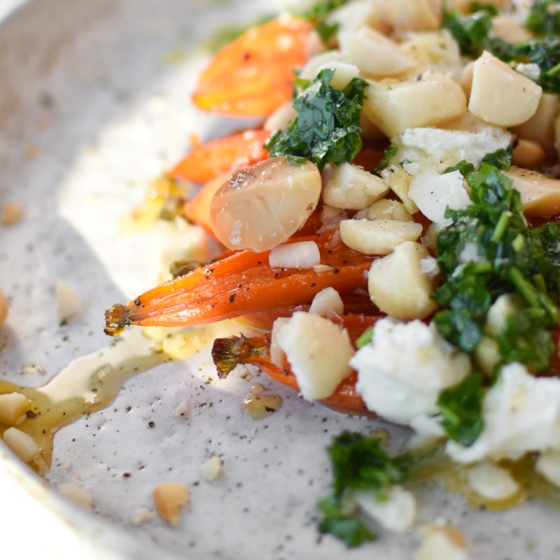 Roasted baby carrots with macadamia nut topping